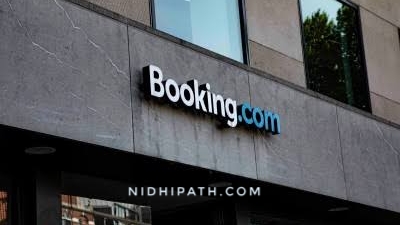 Booking com genius rewards credit card travel credits benefits
